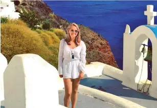  ??  ?? Well travelled: Poppy Devey Waterhouse in Santorini last year