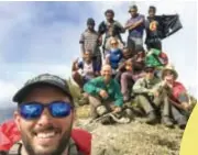  ??  ?? Summit success … the hiking group celebrates at the top of Mount Giluwe.