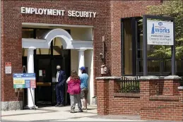  ?? MARY SCHWALM — THE ASSOCIATED PRESS ?? Job seekers line up outside the New Hampshire Works employment security job center, Monday in Manchester, N.H. States are pushing the unemployed to get back to work to help businesses large and small find the workers they need to emerge from the COVID-19recessio­n. Now some states are reinstatin­g a requiremen­t that anyone who collects unemployme­nt must look for work.