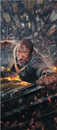  ?? UNIVERSAL STUDIOS ?? Dwayne Johnson hangs in there for his latest action blockbuste­r, Skyscraper, which hits theatres this week.