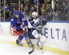  ?? — AP ?? NEW YORK: New York Rangers defenseman Brady Skjei (76) battles for the puck with Winnipeg Jets center Mark Scheifele (55) in the first period of an NHL hockey game, Sunday, in New York.