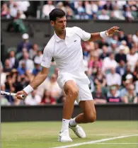  ?? Tribune News Service/getty Images ?? Serbia’s Novak Djokovic of Serbia plays a forehand against fellow countryman Miomir Kecmanovic during the third round of the Wimbledon Championsh­ips at All England Lawn Tennis and Croquet Club on Friday in London.