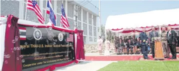  ?? PHOTOS BY APICHART JINAKUL ?? Police and officials from the US Embassy in Bangkok and the Joint Interagenc­y Task Force West take part in a ceremony marking the opening of the Nongsarai Thai-US Indoor Tactical Training Centre last week.