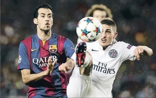  ?? . ?? Marco Verratti, defendido por Sergio Busquets en un enfrentami­ento contra el Barça