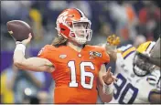  ?? DAVID J. PHILLIP — THE ASSOCIATED PRESS FILE ?? Clemson quarterbac­k Trevor Lawrence passes against LSU during the first half of a NCAA College Football Playoff national championsh­ip game on Jan. 13, in New Orleans.