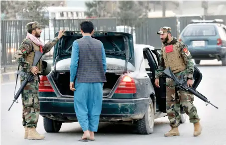  ?? AP ?? Afghan National Army soldiers search a vehicle at a checkpoint in Kabul ahead of presidenti­al elections scheduled for Saturday.