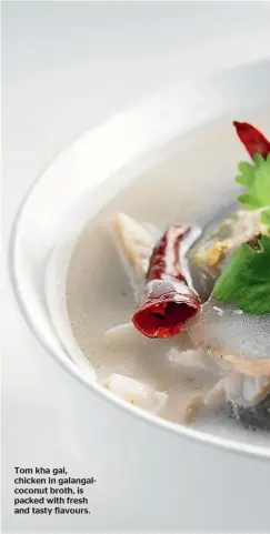  ??  ?? Tom kha gai, chicken in galangalco­conut broth, is packed with fresh and tasty flavours.