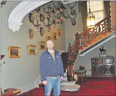  ?? 01_B11castle0­1 ?? Operations manager Jared Bowers in the grand entrance hall of the castle which is unchanged. The 87 stags heads here, all but one from Arran, were removed and cleaned while the castle was closed.