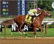 ?? PHOTO ELSA LORIEUL/ NYRA ?? Monomoy Girl races to the finish in Sunday’s Coaching Club American Oaks at Saratoga Race Course.