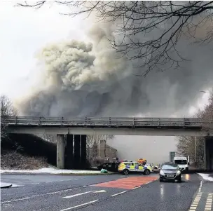  ??  ?? The fire sent a thick plume of smoke ‘up to 60 feet’ into the skies above Haslingden which could be seen from miles away