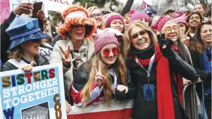  ??  ?? WASHINGTON: In this Jan 21, 2017 file photo, Gloria Steinem, center right, greets protesters at the barricades before speaking at the Women’s March on Washington during the first full day of Donald Trump’s presidency. — AP