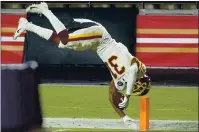  ?? RICK SCUTERI — THE ASSOCIATED PRESS ?? Washington Football Team safety Kamren Curl dives into the end zone after returning a Nick Mullens intercepti­on against the 49ers.