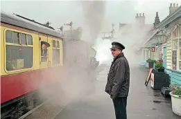  ?? ANDREW JEFFERY ?? Come rain or shine, volunteers are at work in all weathers. Here at Grosmont, on the North Yorkshire Moors Railway, a train for Pickering, hauled by ‘Q6’ 0-8-0 No. 2238, is in the process of being dispatched on a damp autumn day. Platform staff and train guard check it is safe to give the driver the ‘right away’.