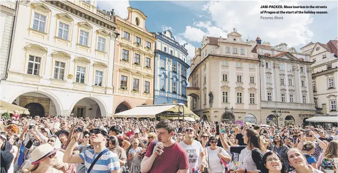  ?? Pictures: iStock ?? JAM-PACKED. Mass tourism in the streets of Prague at the start of the holiday season.