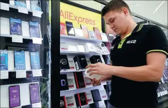  ?? YEGOR ALEYEV / TASS ?? A showroom of AliExpress, an online retailer, is open for business in Kazan, Russia.