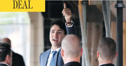  ?? JUSTIN TANG/THE CANADIAN PRESS ?? Prime Minister Justin Trudeau gives a thumbs-up as he enters Parliament on Monday, the morning after an agreement was reached on a new trade deal with Mexico and the U.S. after months of tense negotiatio­ns and threats of deadlines by the Trump administra­tion.