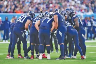  ?? AP PHOTO/STEVE LUCIANO ?? The Tennessee Titans, who are off this week, huddle during last Sunday’s 24-16 loss to the Baltimore Ravens.