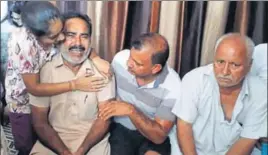  ?? HT PHOTO ?? Relatives of deceased Sunil Kumar consoling his father in Nadala, Kapurthala, on Monday.