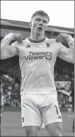  ?? AP ?? Rasmus Hojlund celebrates scoring in Manchester United’s 2- 1 victory at Luton on Sunday. Hojlund finished with a brace to take his tally to seven goals in six straight league games.