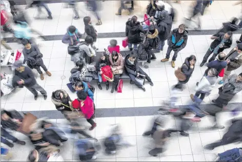  ?? CP PHOTO ?? Shoppers make their way through the Eaton Centre in Toronto on Dec. 26, 2013. The holiday season comes every year and so too the warnings of overspendi­ng, but the consequenc­es of a financial hangover this year are growing compared with just a few years ago.