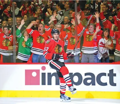  ?? | CHRIS LEE/AP ?? Blackhawks defenseman Trevor van Riemsdyk reacts after scoring in the second period Saturday to tie the game at 3.