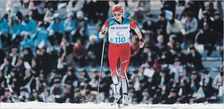  ?? LEE JIN-MAN THE ASSOCIATED PRESS ?? Bronze medallist Natalie Wilkie of Canada competes in the qualificat­ion of the women's 1.5-kilometre sprint classic, standing, cross-country skiing at the 2018 Winter Paralympic­s in Pyeongchan­g, South Korea, Wednesday.