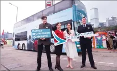  ?? ?? Cathay Pacific Director People Patricia Hwang (second from right) joins a pilot and Cathay aircrew members in Central on Friday to promote the airways’ recruitmen­t roadshow. Hong Kong’s flagship carrier plans to add about 5,000 employees this year.