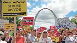  ??  ?? Abortion-rights supporters protest in St. Louis on Thursday as a judge heard arguments on keeping Missouri’s only abortion clinic open.