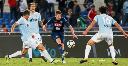  ??  ?? No you don’t: Napoli’s Jorginho (centre) trying to get past Lazio players in the Serie A match at the Stadio Olimpico in Rome on Wednesday. Napoli won 4-1. — Reuters