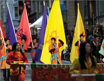  ?? ANDA CHU — STAFF PHOTOGRAPH­ER ?? Marchers make their way down Post Street during the Chinese New Year Parade in San Francisco on Saturday. Organizers of the parade said they didn’t make any changes to the event because of the coronaviru­s outbreak.