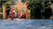  ?? ASSOCIATED PRESS ?? A SWIFT RECUSE BOAT motors through floodwater­s in the aftermath of Hurricane Florence in Nichols, S.C., Friday.