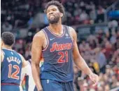  ?? COLE BURSTON/GETTY ?? 76ers’ Joel Embiid reacts to the Raptors bench during Game 6 on Thursday at Scotiabank Arena in Toronto, Canada.