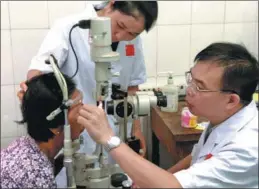  ?? PHOTOS BY HONEY TSANG / CHINA DAILY ?? Clockwise: Leung Chun-ying, a vice-chairman of the CPPCC National Committee, removes gauze from the eyes of a patient who underwent cataract surgery in Kampong Cham, Cambodia, courtesy of a Chinese medical team. Zhong Haibin, one of the ophthalmol­ogists with the team, MAO PENGFEI / XINHUA performs a postoperat­ive checkup on a local patient; Om Saroeun wears sunglasses to prevent irritation of her right eye, which was fitted with a plastic lens by the Chinese volunteers.