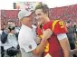  ?? [AP PHOTO/MARCIO JOSE SANCHEZ, FILE] ?? USC head coach Clay Helton, left, smiles at quarterbac­k Kedon Slovis (9) after a 52-35 win over UCLA last season. Both Helton and nowsophomo­re Slovis will return in November.