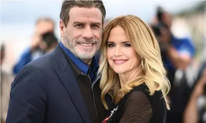  ?? Photograph: Anne-Christine Poujoulat/AFP/Getty Images ?? Kelly Preston and John Travolta pose during a photocall for the film Gotti in 2018. Preston died on Sunday from breast cancer.