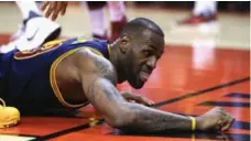  ?? VAUGHN RIDLEY/GETTY IMAGES ?? The fall of King James in Game 3 was still a talking point the day after. Superstars such as LeBron tend to get different treatment this time of year.