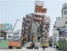  ?? REUTERS ?? WORKERS carry out demolition operations on the Uranus building, which was damaged in the April 3 earthquake, in Hualien, Taiwan, yesterday. |