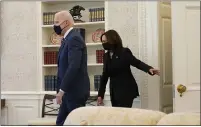  ??  ?? President Joe Biden and Vice President Kamala Harris arrive at the Oval Office of the White House in Washington on Thursday.