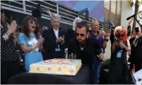  ?? (Mario Anzuoni/Reuters) ?? RINGO STARR blows out candles on a cake at an event to celebrate his 77th birthday in Los Angeles.