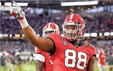  ?? ASHLEY LANDIS/AP ?? Georgia defensive lineman Jalen Carter (88) is viewed as a can’t-miss, disruptive force who could have Aaron Donald-type consequenc­es to opposing NFL offenses.