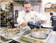  ?? Jerry Baker ?? Drew Rogers, pastry chef and owner of Drew’s Pastry Place, works on one of his Sticky Toffee Cheesecake­s in his kitchen.