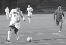  ?? MIKE BUSH/ NEWS-SENTINEL ?? Tokay striker Lionardo Ruiz (9) is ahead of the his teammates and Turlock's Beni Mejia (7) in Tuesday's SacJoaquin Section Division I boys soccer playoff game at the Grape Bowl.