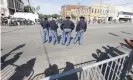  ?? Photograph: Erik S Lesser/EPA ?? Alabama state troopers stand near the Edmund Pettus Bridge.