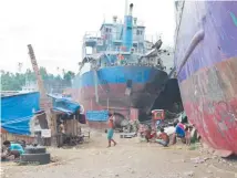  ??  ?? Ships that killed hundreds in Tacloban when they were thrown around during Typhoon Haiyan now house the homeless.