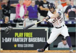  ?? Michael Wyke ?? The Associated Press Jose Altuve tries to check his swing on a 101-mph fastball from Yankees reliever Aroldis Chapman, striking out to end the Astros’ 6-5 loss Thursday at Minute Maid Park.