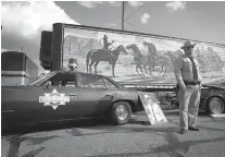  ?? File photo by Evan Lewis ?? David Betz, aka Buford T. Justice, of St. Joseph, Mo., stands beside his 1977 Pontiac LeMans in this May 2012 photo. That was the last time the Bandit Run rolled through Texarkana.