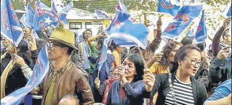  ?? PTI ?? Mizo National Front (MNF) workers celebrate their party's poll victory in Aizawl on Tuesday.