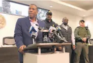 ?? Adrian Sainz / Associated Press ?? Forrest City Mayor Cedric Williams (left) praised the police officers wounded in the shooting.