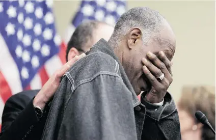  ?? T. J. KIRKPATRIC­K/ GETTY IMAGES ?? Secretary of Labor Thomas Perez comforts Ruben Jones, a low- wage worker who spoke about his struggles to make ends meet working minimum wage jobs, during a stop of the ‘ Give America a Raise’ bus tour at the U. S. Capitol Building on April 3.