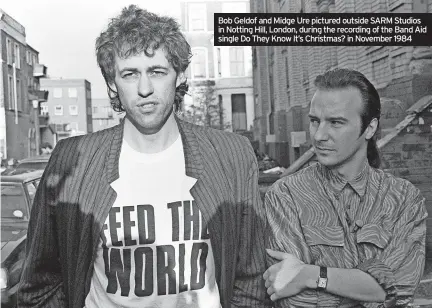  ?? ?? Bob Geldof and Midge Ure pictured outside SARM Studios in Notting Hill, London, during the recording of the Band Aid single Do They Know It’s Christmas? in November 1984